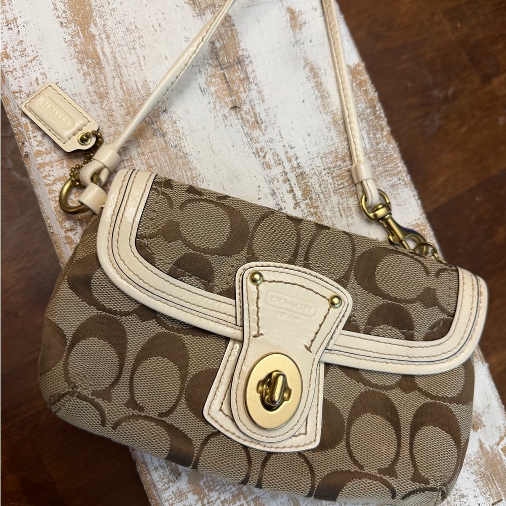 Coach turn lock  Tan and Cream Signature Wristlet